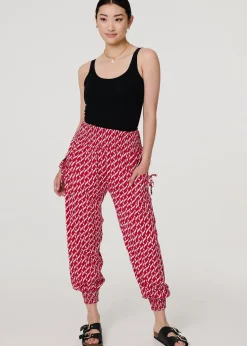 Izabel London Red Printed Tapered Harem Trousers